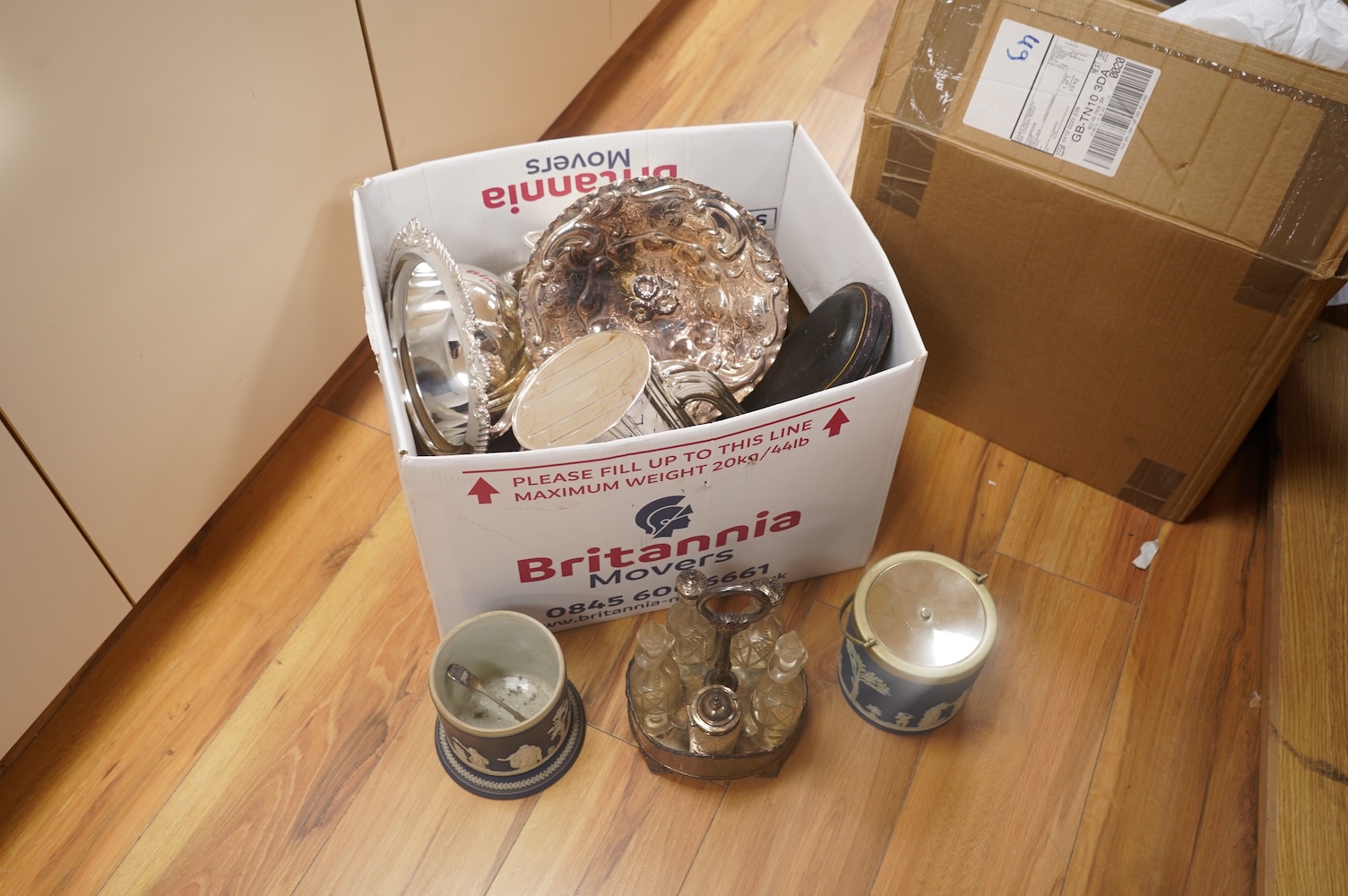A collection of plated items, including a pair of candle holders, coffee pot, a jasper ware biscuit box and similar pot without cover. Condition - varies